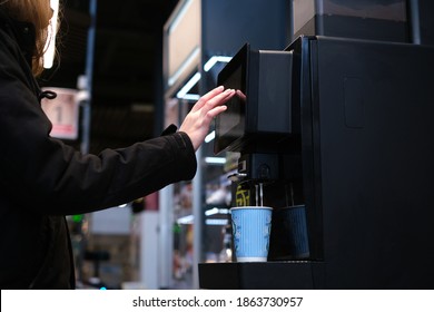 Man Makes Himself Coffee In A Self-service Machine. Cappuccino At The Checkout In The Store. Vending Machine With Coffee In The Supermarket.mockup