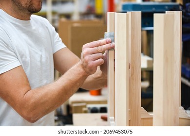 A Man Is Making Bespoke Furniture In A Woodwork Workshop Showing The Construction Process