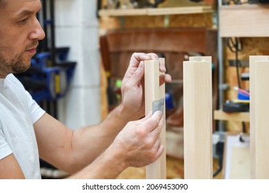 A Man Is Making Bespoke Furniture In A Woodwork Workshop Showing The Construction Process