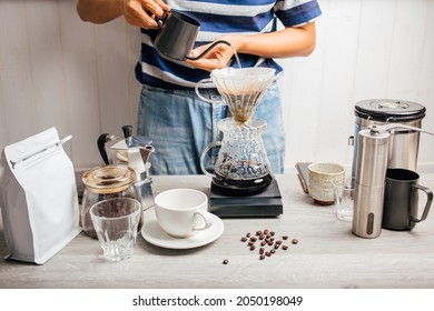 Man Making Coffee For Dripping Hot Coffee Into The Cup With Equipment, Tool Brewing At Kitchen Home