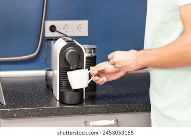 Man making coffee in coffee machine at home	 - Powered by Shutterstock