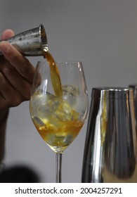 Man Making A Coffee Mocktail. Ingredients Tepache, Coffee, Soda Water With Rosemary