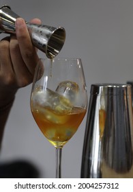 Man Making A Coffee Mocktail. Ingredients Tepache, Coffee, Soda Water With Rosemary