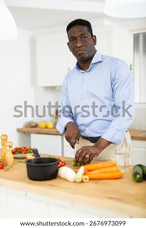 Man making dinner at kitchen table