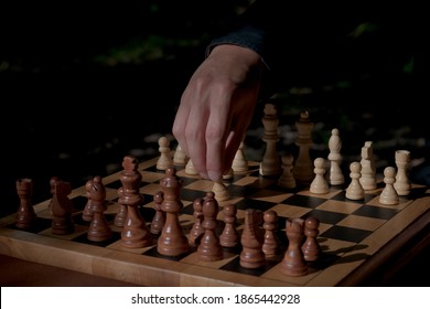 Man Making First Move In A Chess Game, Pawn Two Steps Ahead Seen From Blacks