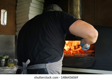 Man making hand made pizza using fresh ingredients  - Powered by Shutterstock