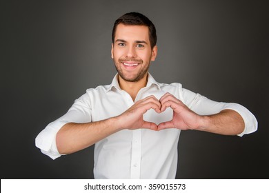 Man Making A Heart Shape With His Hands.