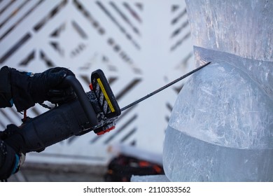 Man Making Ice Sculpture With Dnipro Chainsaw