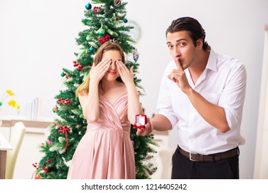 Man Making Marriage Proposal At Christmas Day