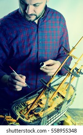 Man Making Model Ship.