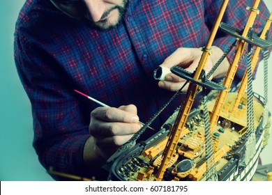 Man Making Model Ship.