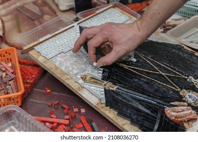 Man making mosaic. Process of making mosaic. 