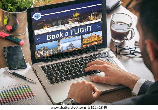 Man making an online\
flight reservation