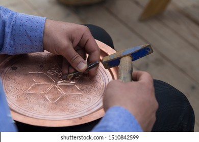 The Man Making Pattern On The Copper Plate.