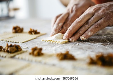 Man making ravioli, Italian cuisine and gluten-free - Powered by Shutterstock