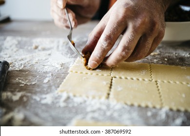 Man making ravioli, Italian cuisine and gluten-free - Powered by Shutterstock