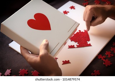 Man Making Red Heart Shaped Puzzle. Concept For Giving Love Or Do Charity. Every Little Bit Helps