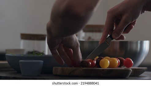 Man Making Salad Cut Tomatoes, Wide Photo