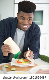 A Man Making A Sandwich