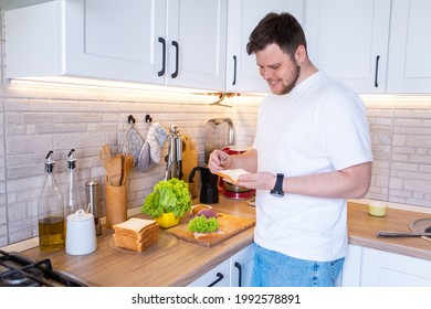 Man Making Sandwich On The Kitchen Copy Space