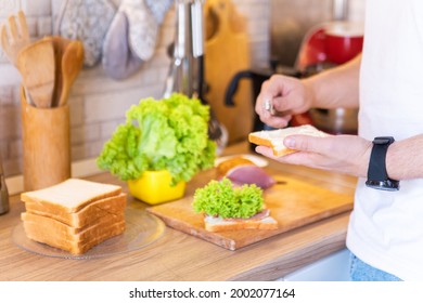 Man Making Sandwich On The Kitchen Copy Space