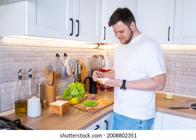 Man Making Sandwich On The Kitchen Copy Space