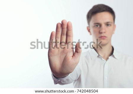 Man making stop gesture