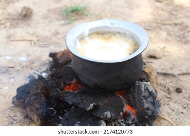 man making tea on dry cow dung,use of cow dung, indian tea making with cow dung,