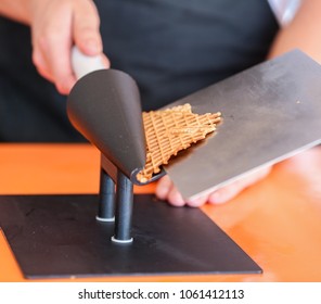 Man Making Waffle Cone Close Up