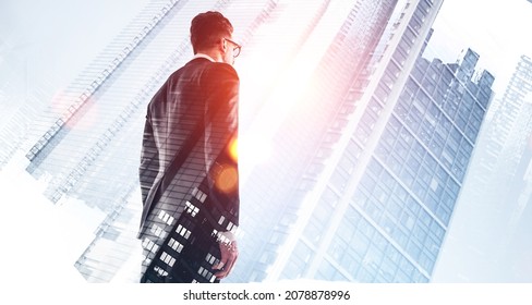 Man Manager In Business Suit, Back View Looking At Office Buildings, Double Exposure. Concept Of Personal Development, Idea And Career Growth