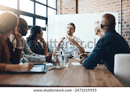 Similar – Image, Stock Photo Work colleagues in a tailor shop, one in focus, share a moment in a sewing workspace. They’re surrounded by colorful threads, with one holding a spool of red thread