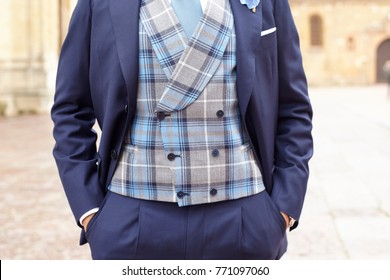 Man In Marine Blue Suit With Plaid Vest