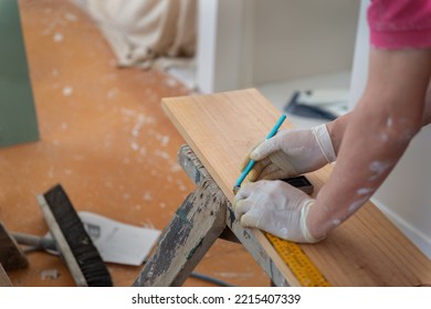 Man Marking The Line On Wood With Pencil, Selective Focus On Pencil. Home Refurbishment Do It Yourself Project. 