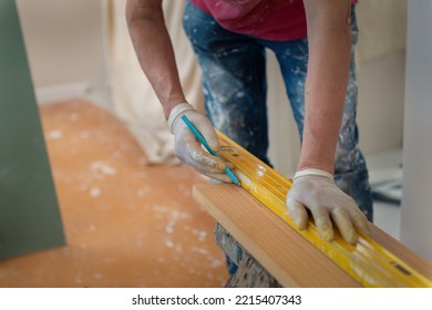 Man Marking The Line On Wood With Pencil, Selective Focus On Pencil. Home Refurbishment Do It Yourself Project. 