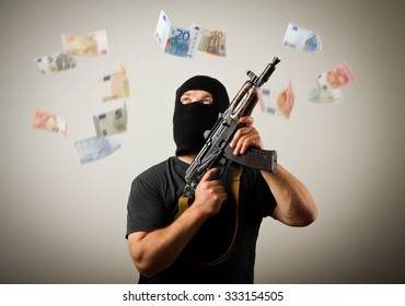 Man in mask with gun and falling euro banknotes.