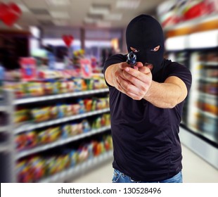 Man In A Mask With A Gun In The Supermarket