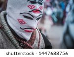 man with mask looking down