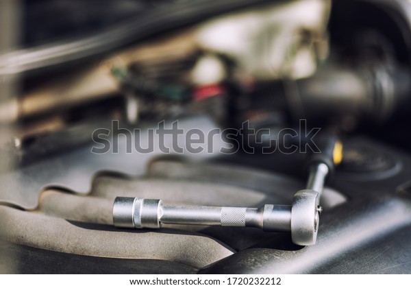 Man master repairs under the hood of the car.
Repairing concept