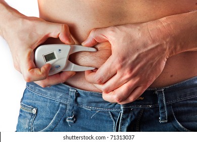 Man Measuring Body Fat With Caliper