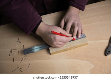 A man measuring wood with a ruler and pencil, symbolizing precision, craftsmanship, and woodworking skills. - Powered by Shutterstock