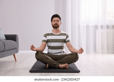 Man meditating at home. Harmony and zen - Powered by Shutterstock