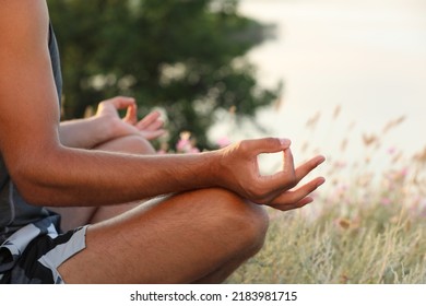 Man Meditating Outdoors On Summer Day, Closeup