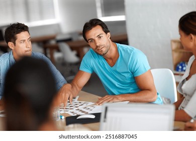 Man, meeting and discussion in group with photos, questions and choice in office at marketing company. Business people, startup and team with planning, review or decision for model at creative agency - Powered by Shutterstock