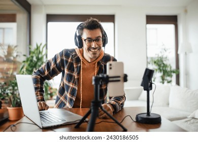 Man as mental health influencer making video for social media. Influencer, doing telepsychology, creating online content about mental health, well-being, teaching breath exercises.
