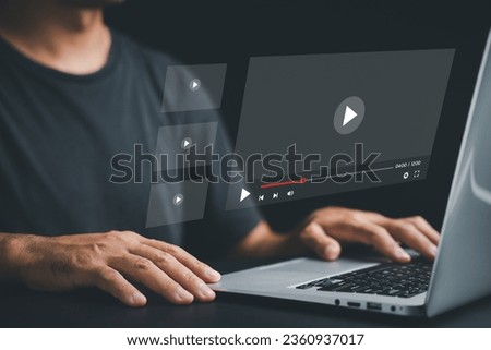 Man mesmerized by a live stream on the internet. Conceptual image of online video streaming with a multimedia player on the screen. Stay entertained and informed anytime, anywhere.