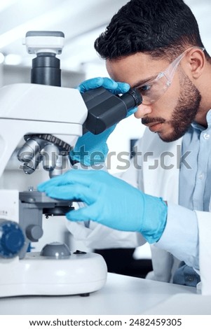 Man, microscope and research analysis in lab, biochemist and innovation healthcare study with virus sample. Investigation, cure development and breakthrough, medical and goggles with professional