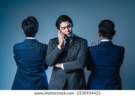 A man in a middle management position who is troubled between his boss and his subordinates.