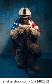 Man Military Outfit A Mercenary Soldier In Modern Times With US Flag In Studio