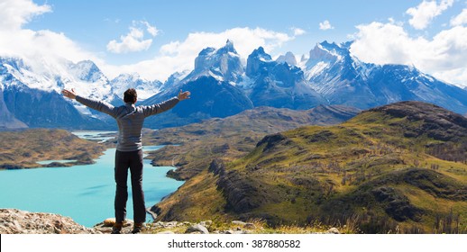 man at mirador condor enjoying hiking and view of cuernos del paine in torres del paine national park, patagonia, chile