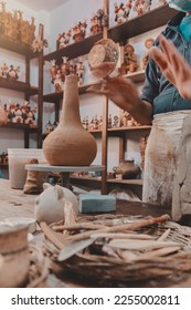 Man molding clay to make ceramics with his hands, Artisan working in his workshop, Selective Focus - Shutterstock ID 2255002811